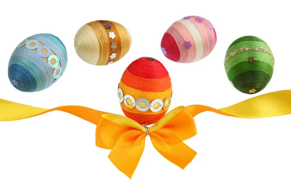 Orange ribbon and colorful eggs — Stock Photo, Image