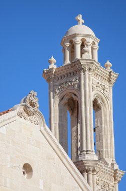 High church bell tower opposite blue sky clipart