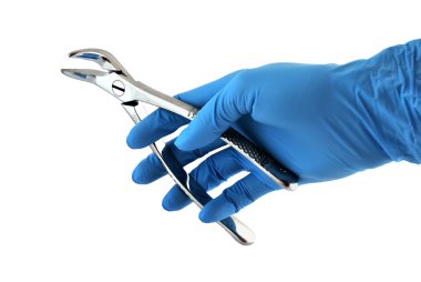 Dental forceps in hand clipart