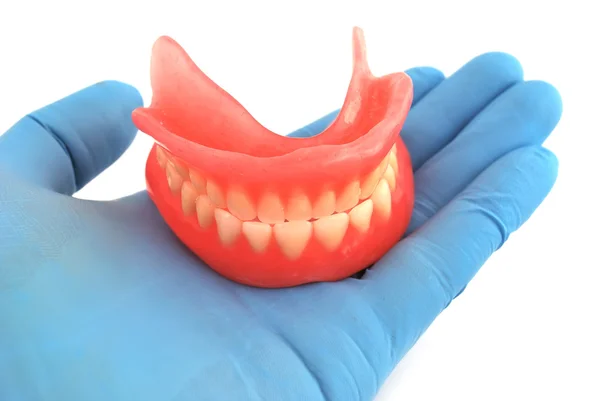 Prótesis dentales en mano —  Fotos de Stock