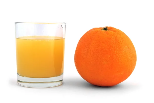 Orange och ett glas saft — Stockfoto