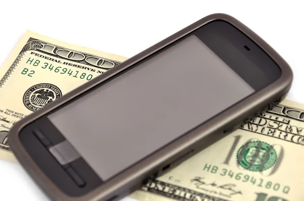 Dotykový mobilní telefon a dolar — Stock fotografie