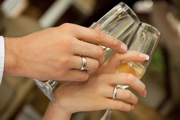 Stock image Bride and groom holding glasses