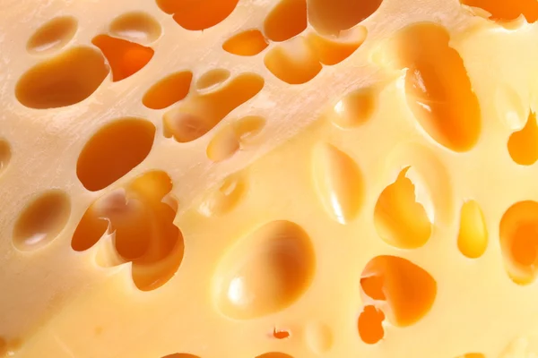 Tekstury szwajcarski ser z bliska — Zdjęcie stockowe