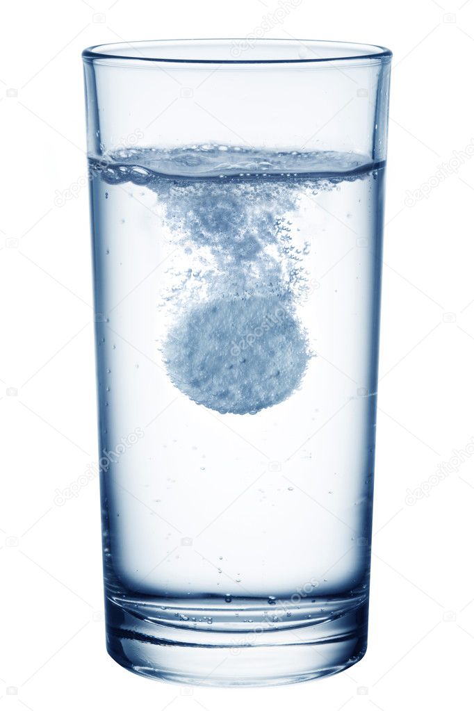 Fizzy pill in the glass of water.