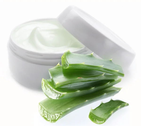 Opened plastic container with cream and aloe. — Stock Photo, Image
