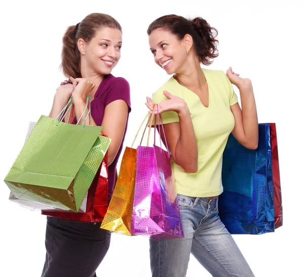 Två vänner med shopping på vit bakgrund — Stockfoto