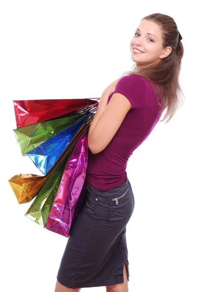 Menina com compras em um fundo branco . — Fotografia de Stock