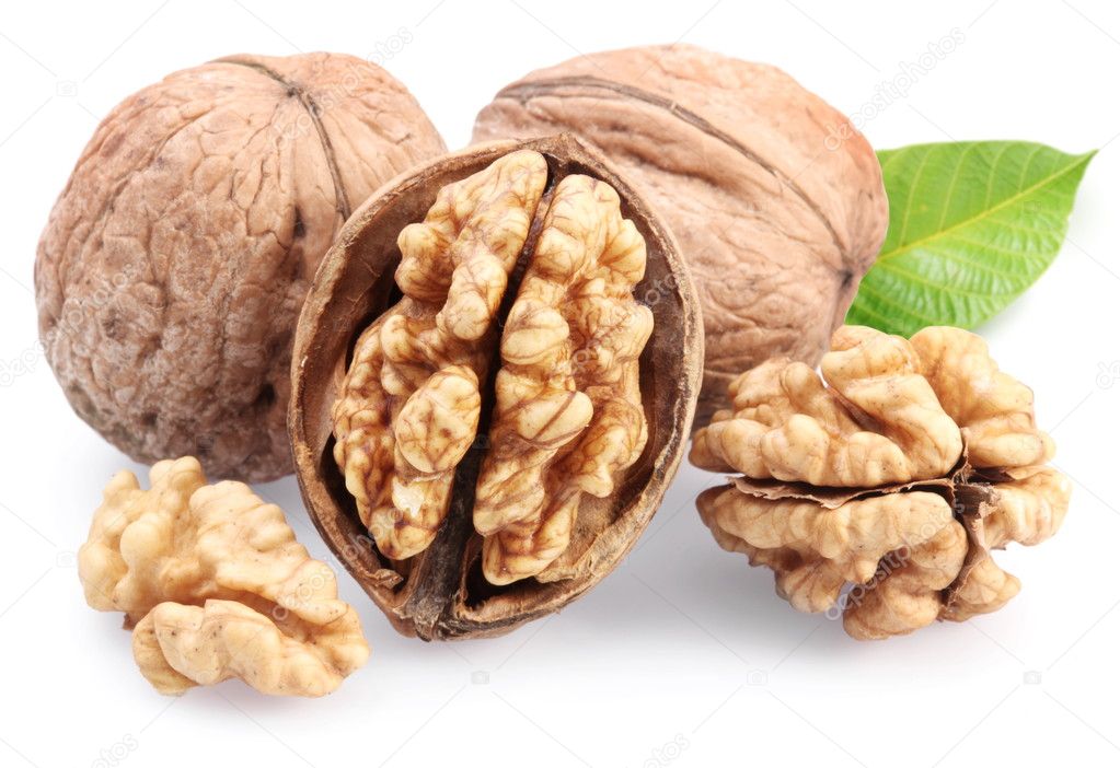 Walnuts with leaf isolated on a white background.