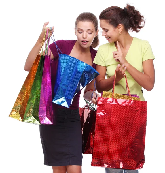 Two friends with shopping. One girl wonders purchases second gir — Stock Photo, Image