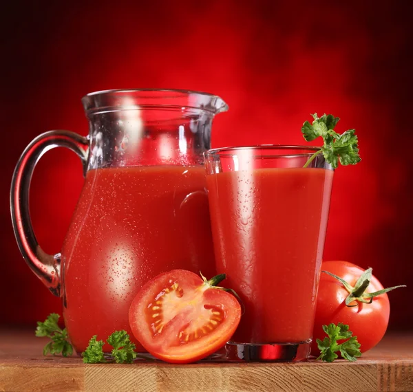Jug and glass full of tomato juice. — Stock Photo, Image