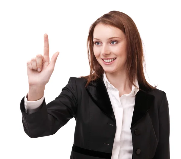 Mujer joven en traje de negocios empuja sobre vidrio con el dedo. Aislamiento —  Fotos de Stock