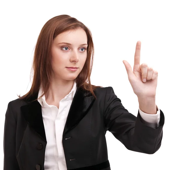 Young woman in business suit pushes on glass with finger. Isolat — Stock Photo, Image
