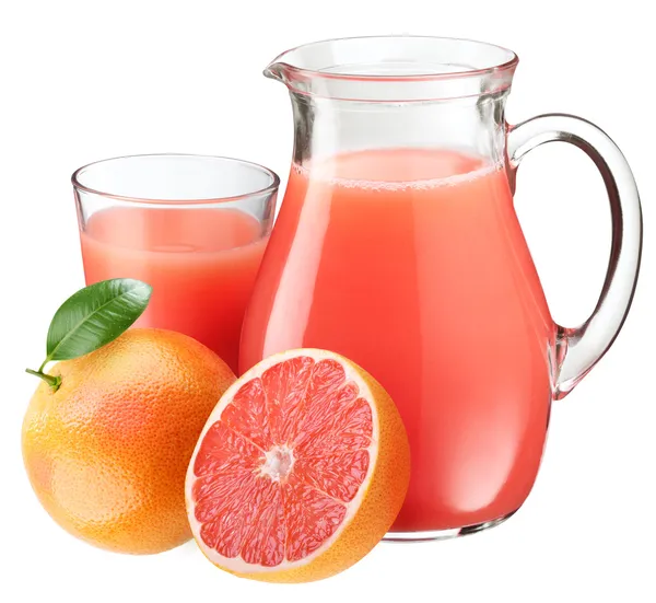 Grapefruktjuice och frukt. — Stockfoto