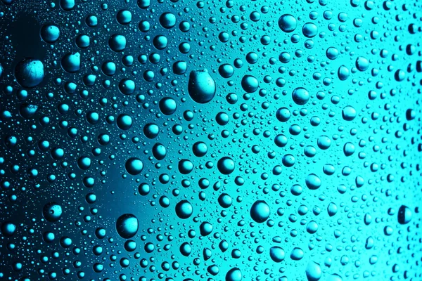 Textuur water druppels op de fles. — Stockfoto