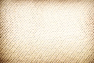 Texture of the yellow fabric close up. Edges of the image blacked. clipart