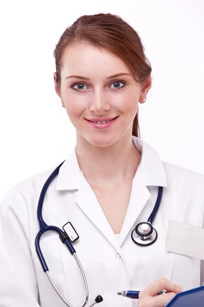 Porträtt av en positiv leende kvinna i medicinsk uniform. — Stock fotografie