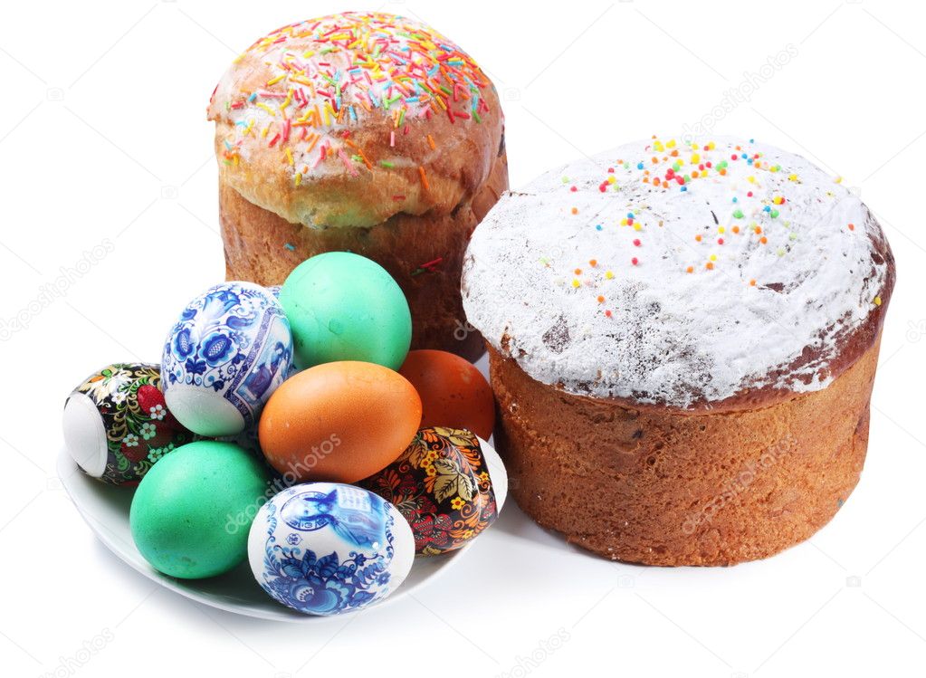 Multi-colored eggs on a plate and cakes. Easter holiday. Isolate