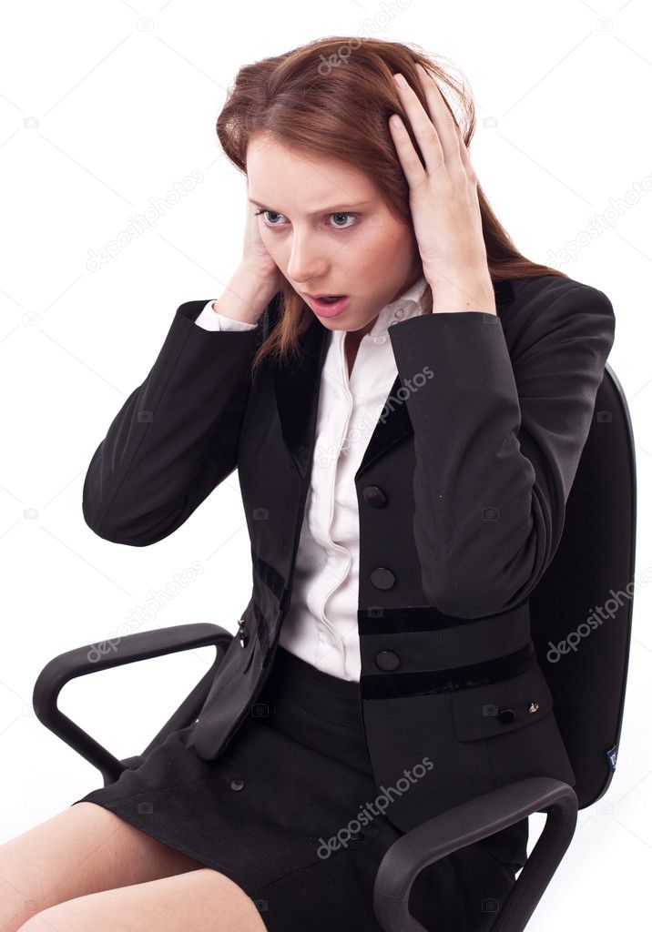 Depressed young woman sitting on a chair.