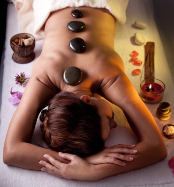Young woman getting spa procedures. clipart