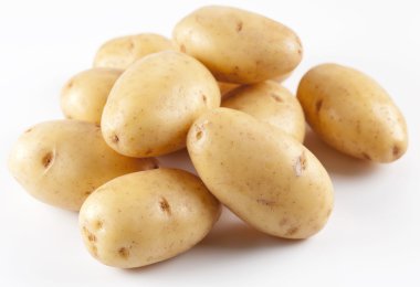 Yellow potatoes on a white background clipart