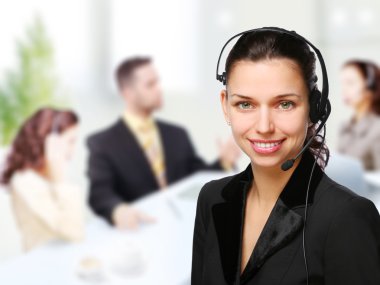 Customer support operator woman smiling at an office clipart