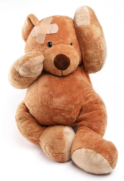 Teddy bear in een punt van zorg. geïsoleerd over Wit. — Stockfoto