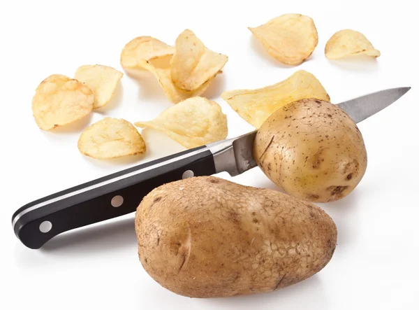 stock image Conceptual image - the knife cuts fresh potatoes and potato chip