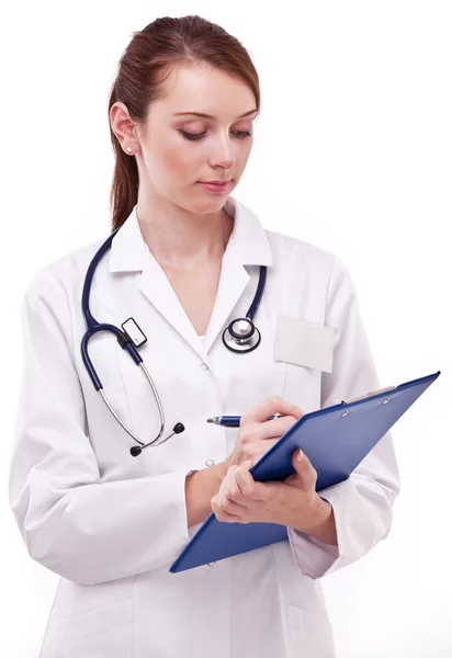 Médico a preencher o cartão médico. Isolado em um backgroun branco — Fotografia de Stock
