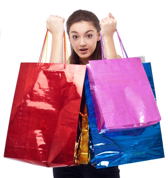 Chica feliz con bolsas de compras. Aislado sobre un fondo blanco —  Fotos de Stock