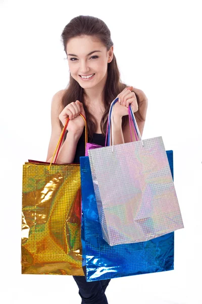 買い物袋との幸せな女の子。白い背景で隔離 — ストック写真