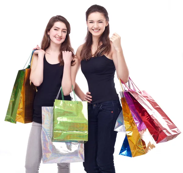 Menina com sacos de compras em um fundo branco. — Fotografia de Stock