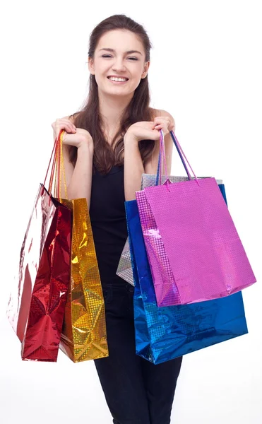Beyaz arka planda alışveriş torbaları olan bir kız.. — Stok fotoğraf