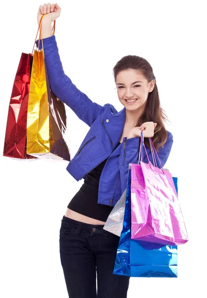Κορίτσι με τσάντες ψώνια σε λευκό φόντο. — Φωτογραφία Αρχείου