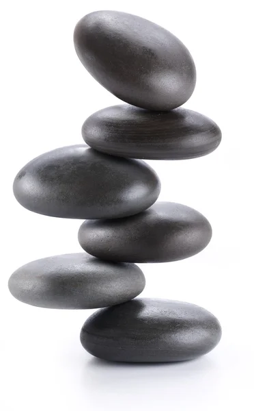 Kreatives Bild - Pyramide aus balancierenden Wellness-Steinen auf weißem Rücken — Stockfoto