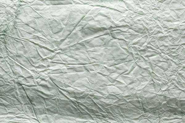 Doku görüntü beyaz - yeşil kağıt buruşuk. — Stok fotoğraf