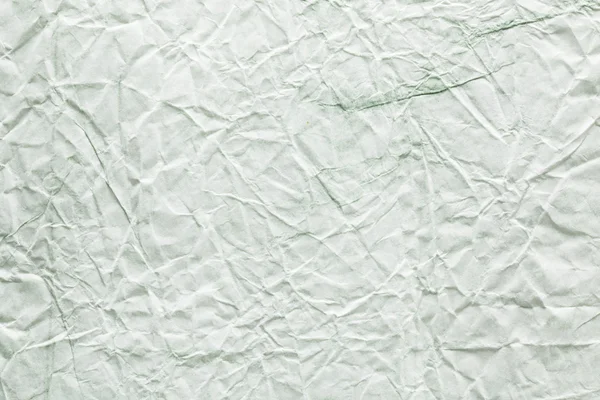 Doku görüntü beyaz - yeşil kağıt buruşuk. — Stok fotoğraf