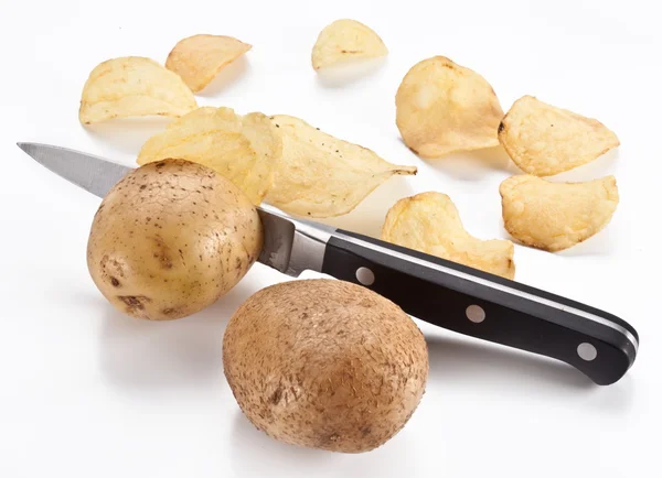 Conceptual image - the knife cuts fresh potatoes and potato chip Stock Image