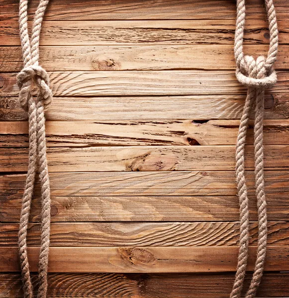 Afbeelding van oude textuur van houten planken met schip touw. Stockfoto