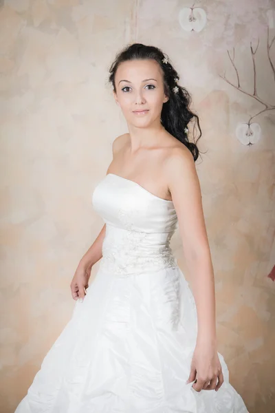 Tender bride in an elegant white dress — Stock Photo, Image