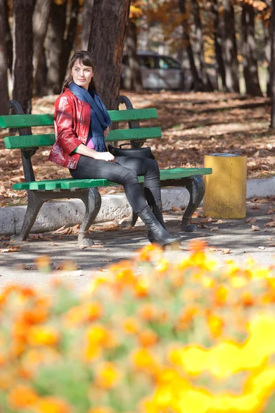 stock image Beautiful girl on a park bench