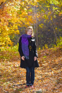 Active beautiful girl in autumn wood