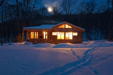 House in the snow on the outskirts of the village clipart