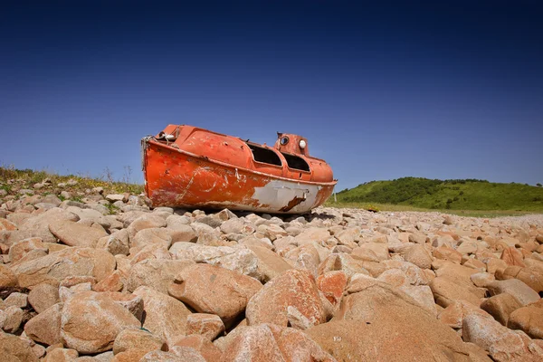 Boat lies on the beach Royalty Free Stock Photos