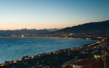 The city of Kalamata, Greece, at dusk clipart