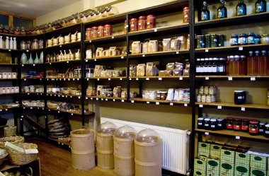 Organic Spices On Shelves In A Spice Market clipart