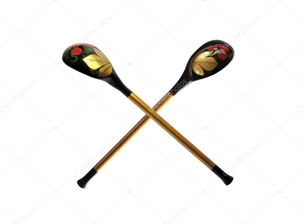 Two wooden spoons with color varnished pattern isolated over white background