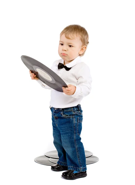De kleine jongen met fonograaf records op wit — Stockfoto