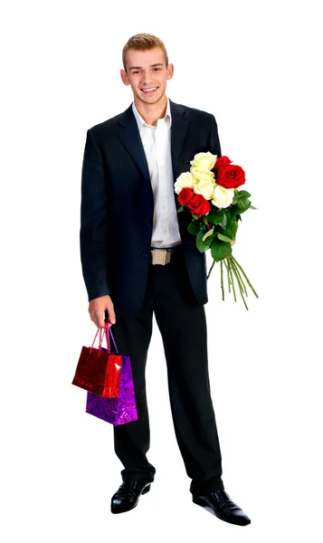 バラと若い男 白で隔離されるショッピング バッグ — ストック写真
