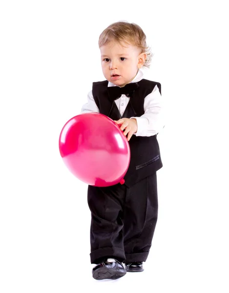 Menino na idade de um ano segurando balão — Fotografia de Stock